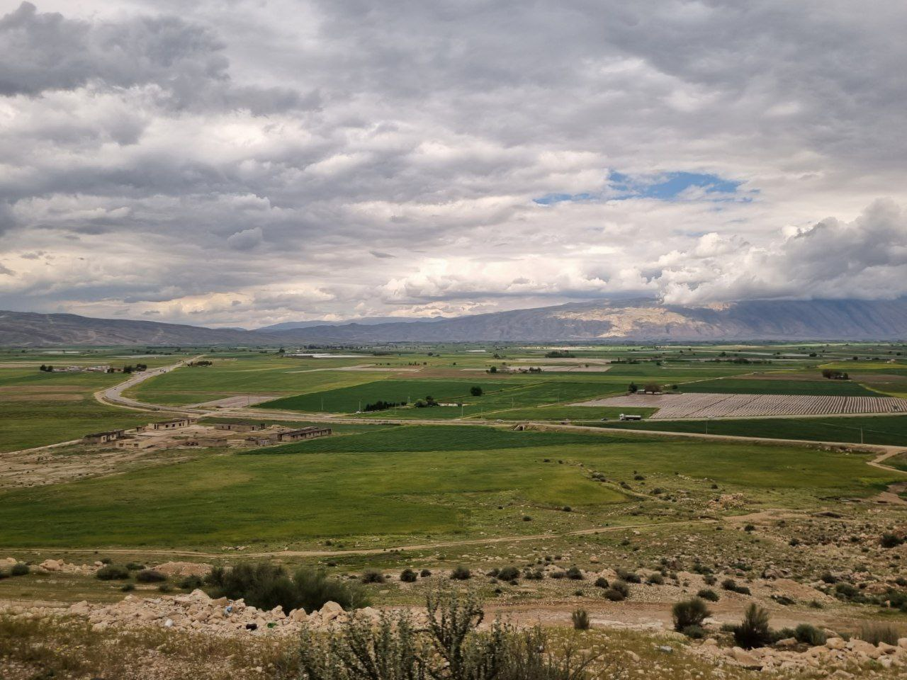 Fields and cloud shadows near Firuzabad.