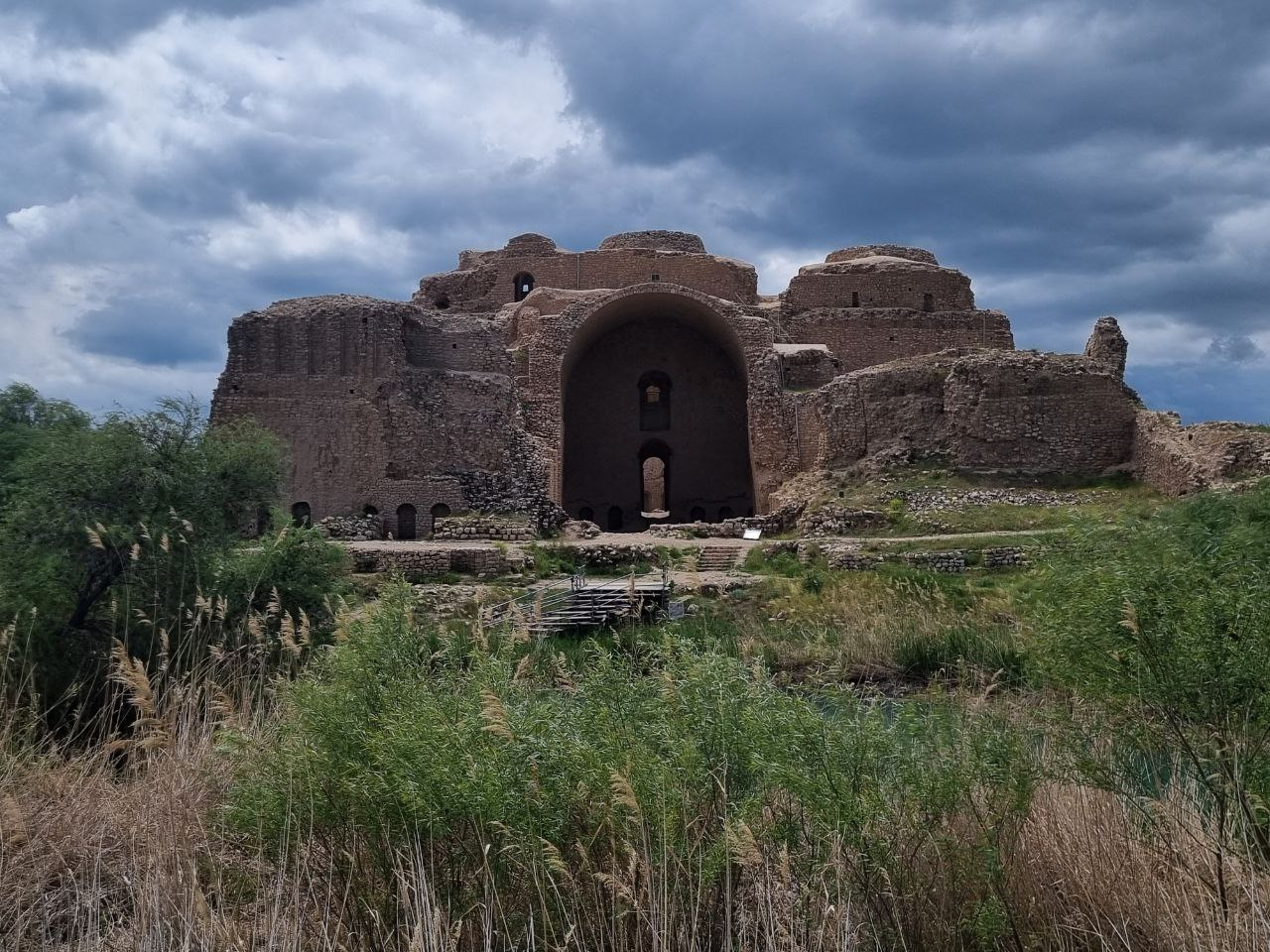 Palace of Ardashir — the vaulted entrance beyond the pool.