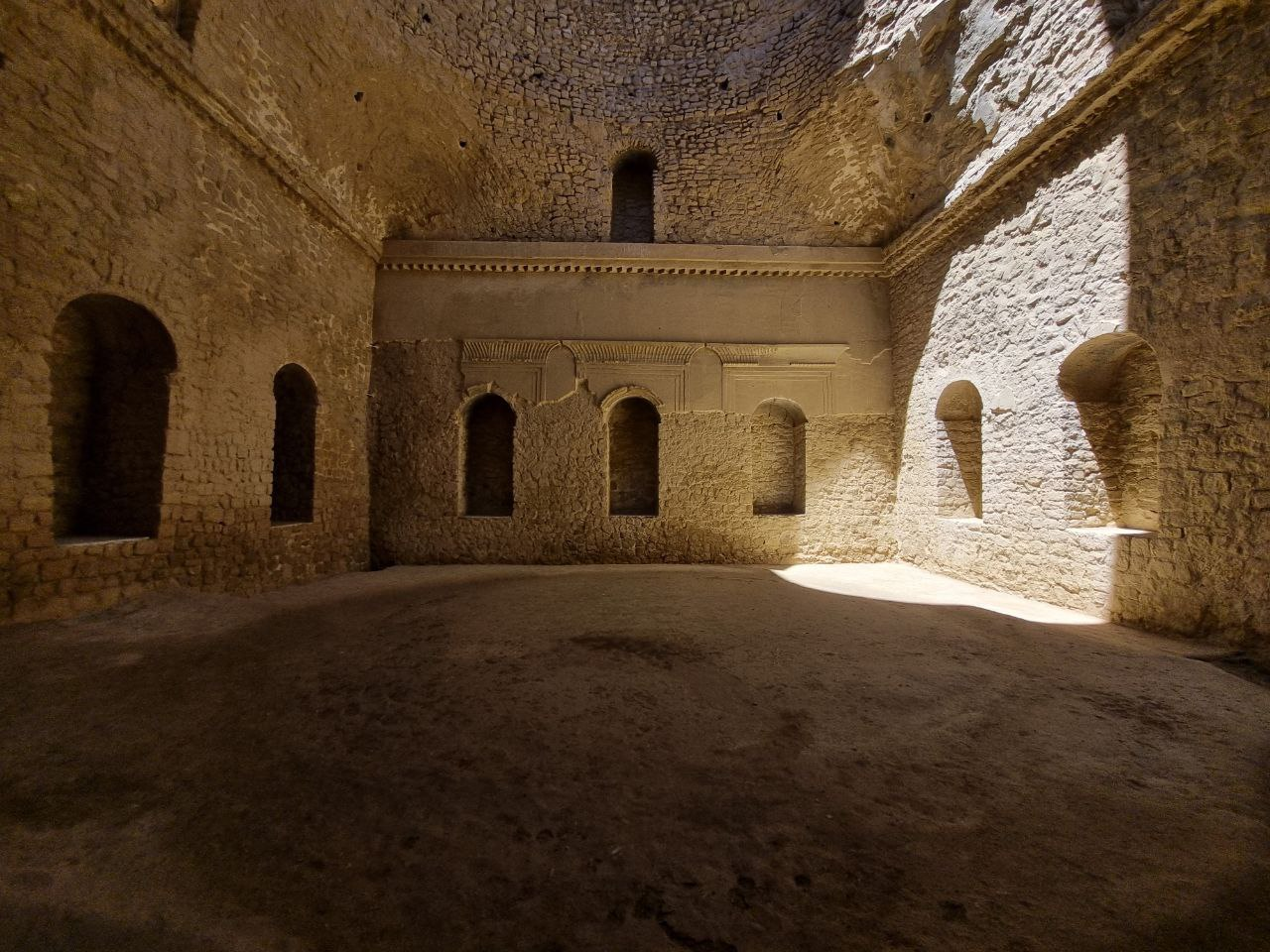 Palace of Ardashir — niches, thick walls and light in a domed room.