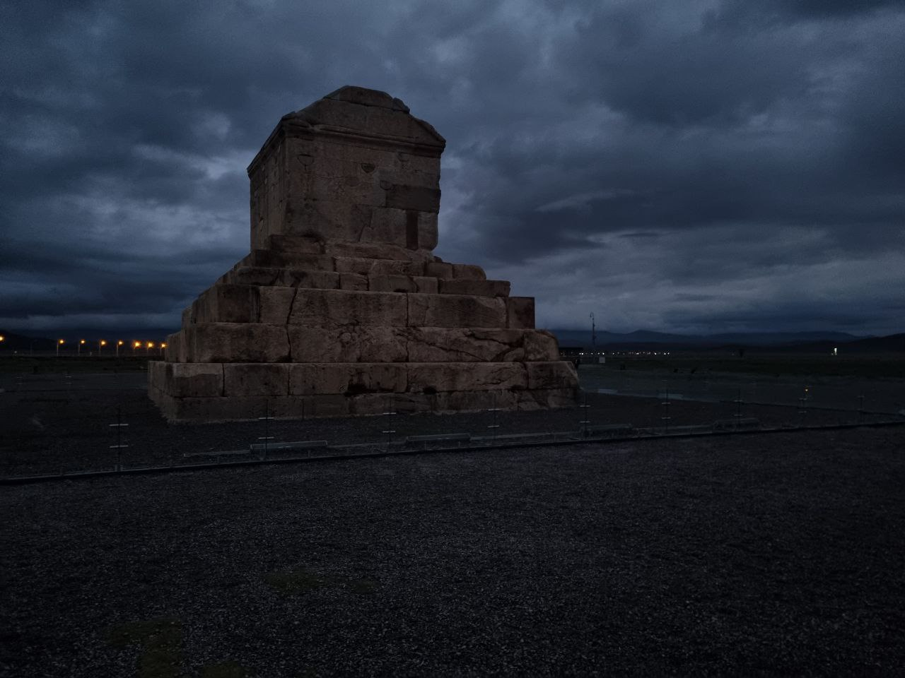 Tomb of Cyrus, Pasargadae — beneath a darkening sky.