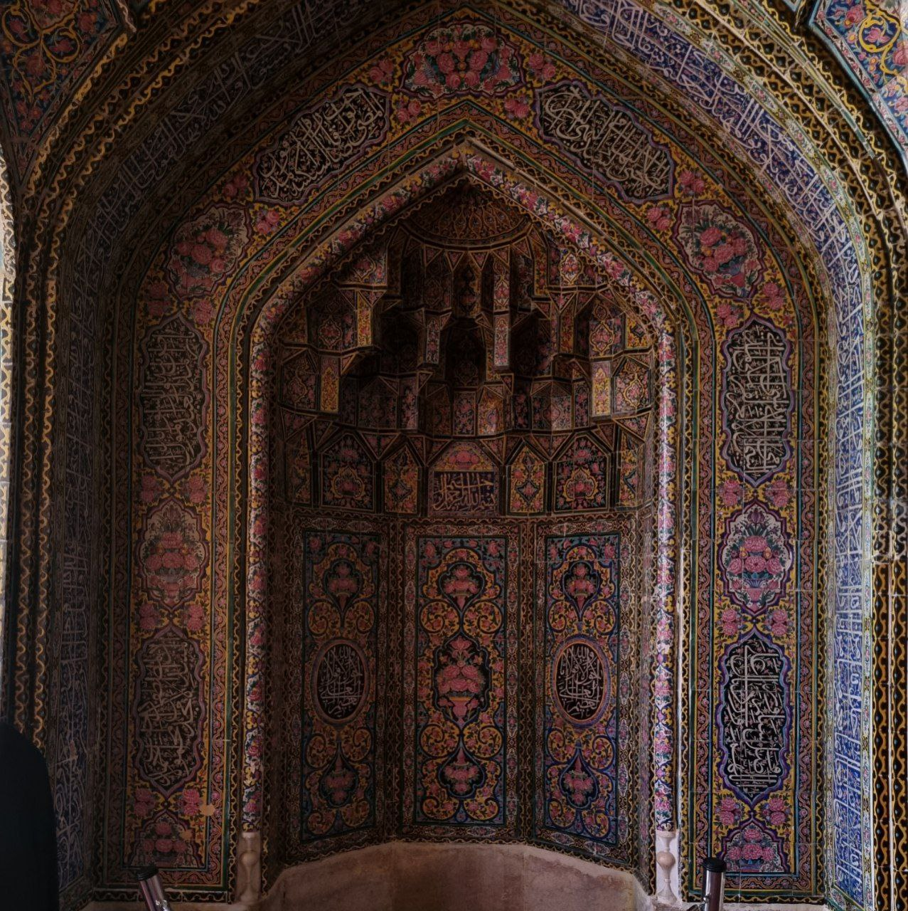 Nasir al-Mulk Mosque — tilework and muqarnas within a pointed arch.