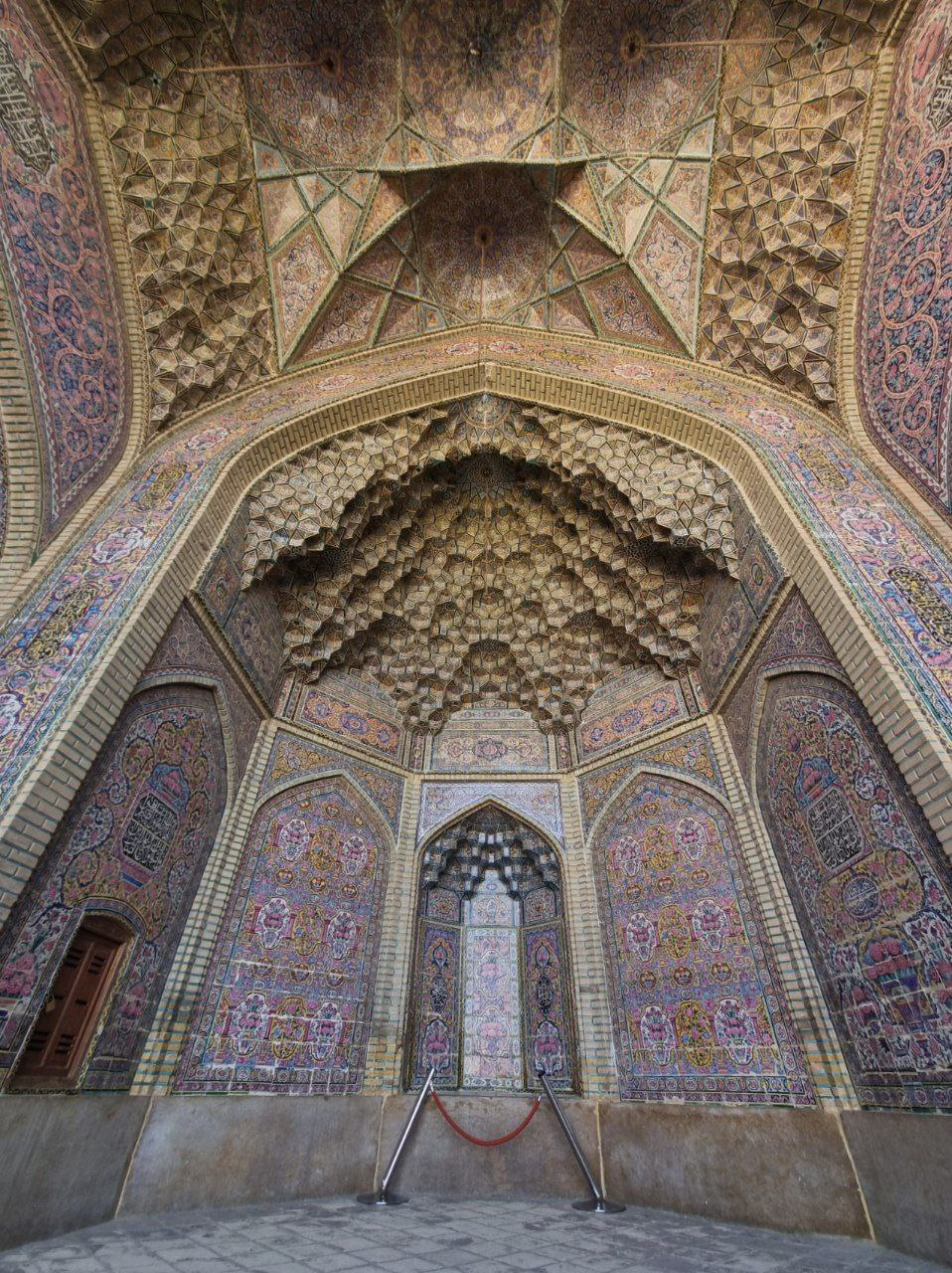 Nasir al-Mulk Mosque — the courtyard iwan and its muqarnas.