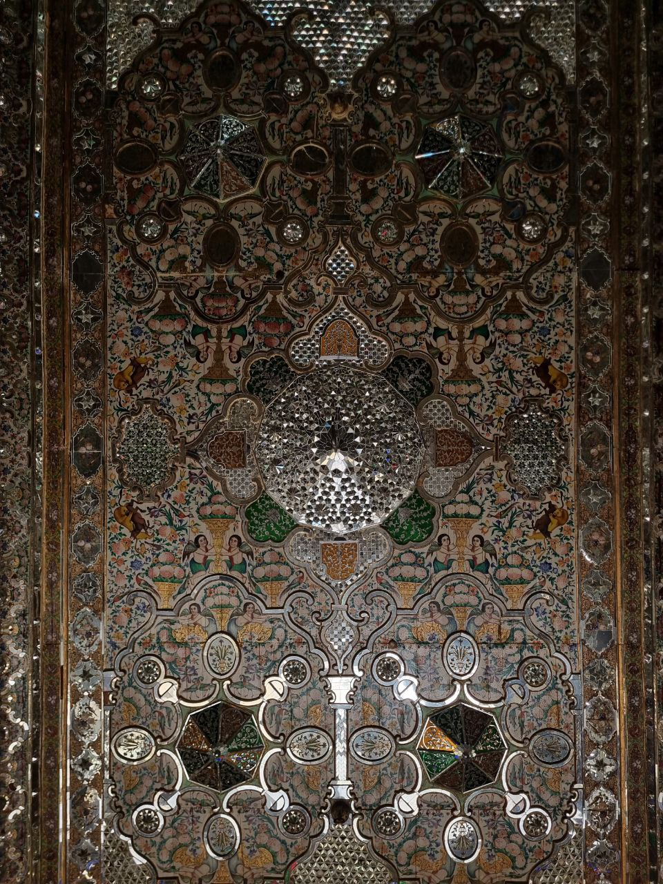 Painted figures, flowers and mirrorwork in a historic house.