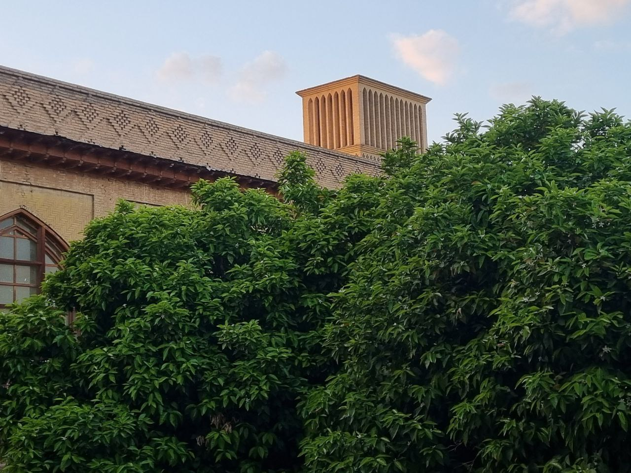 Arg of Karim Khan — citrus trees beneath the windcatcher.