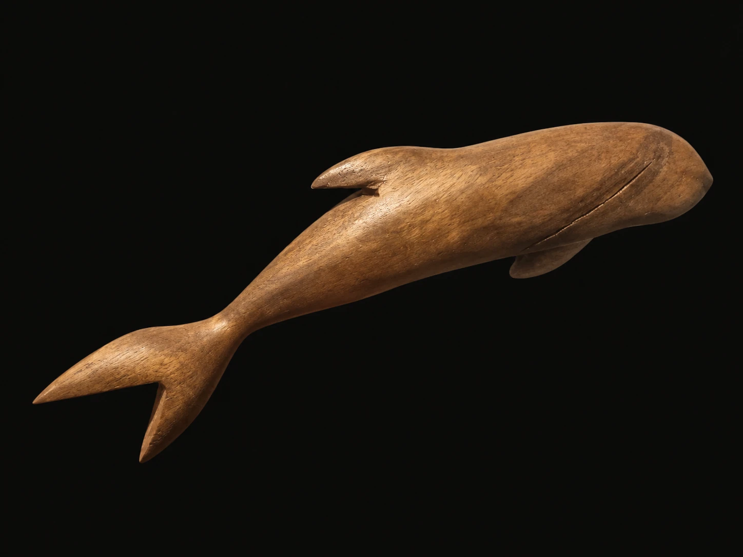 Carved wooden dolphin / background-cleaned presentation from the original photograph