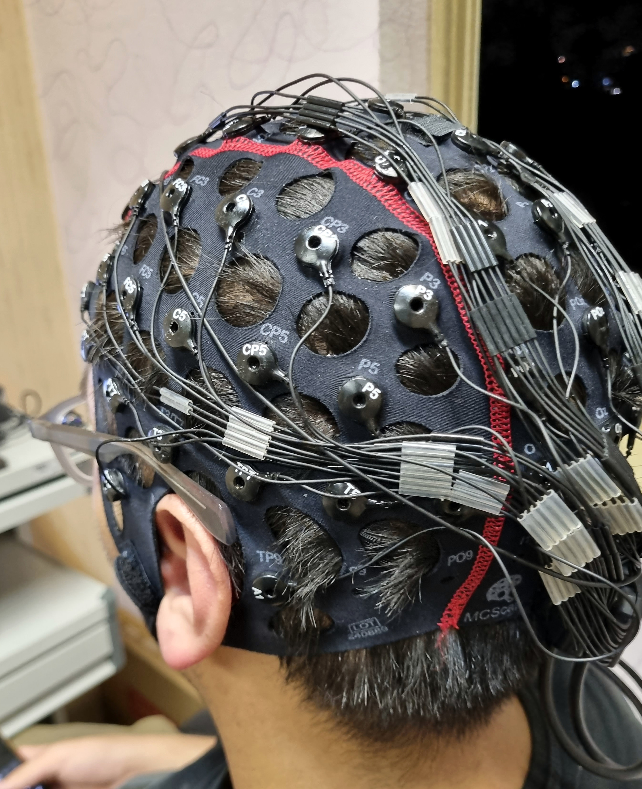 Rear view of EEG cap and bundled cable routing