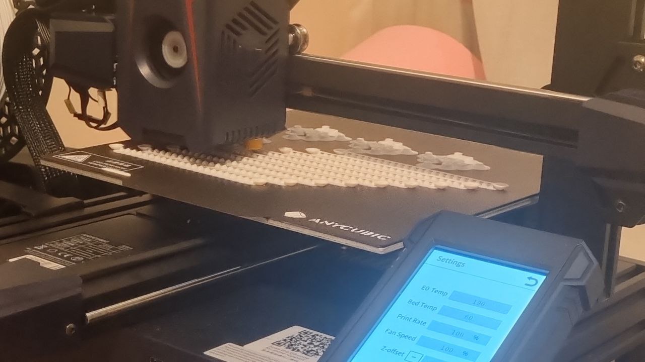 White Universal Joint parts printing on an FDM printer