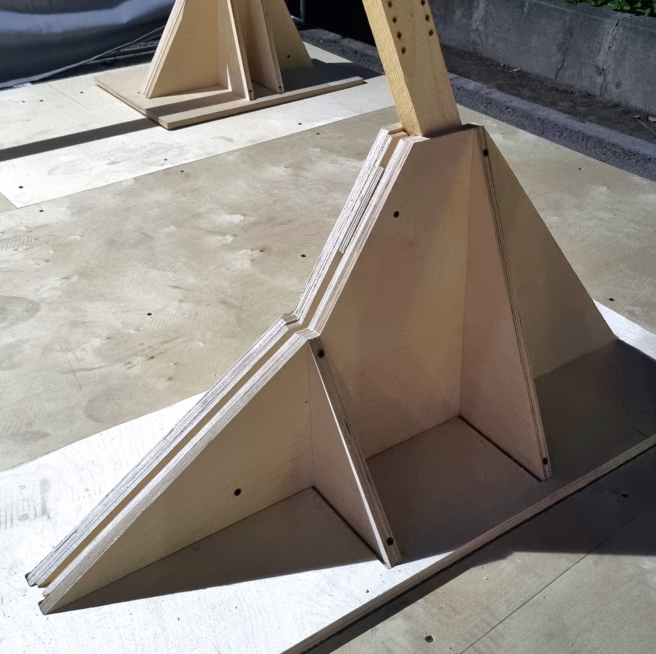 Built plywood base and inserted angled timber member