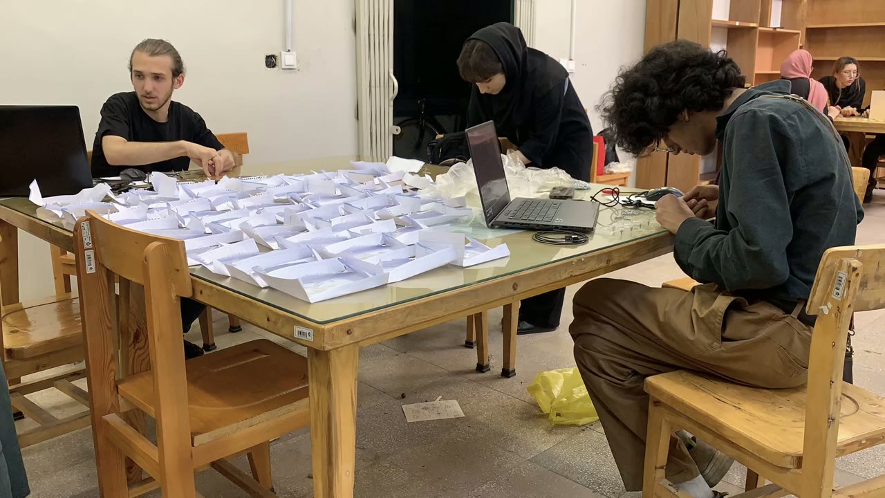 Project participants working at a table of parts